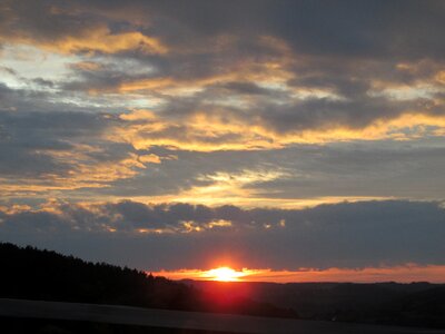 Setting sun clouds orange photo