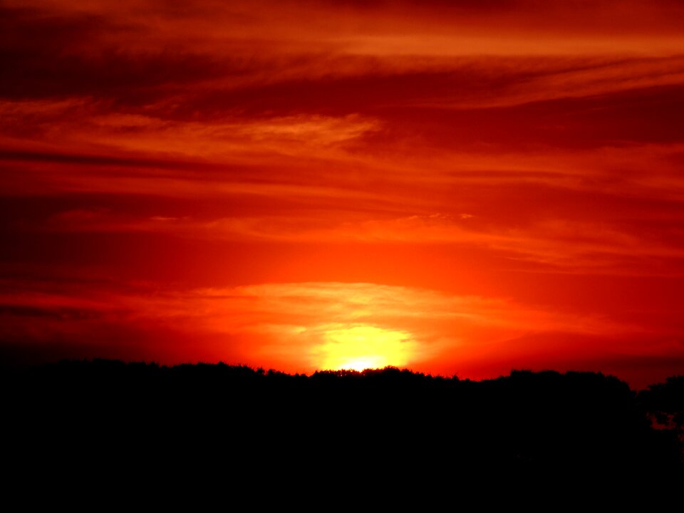 Sunset against light clouds in the sun