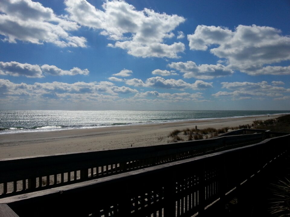 Coast boardwalk clouds