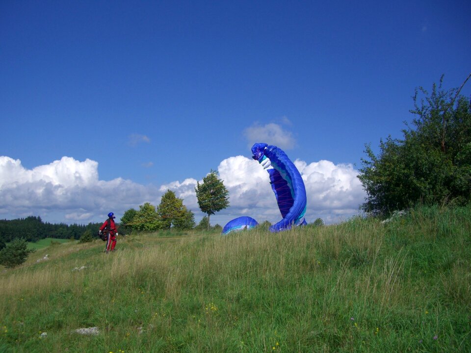 Paraglider floating sailing sky