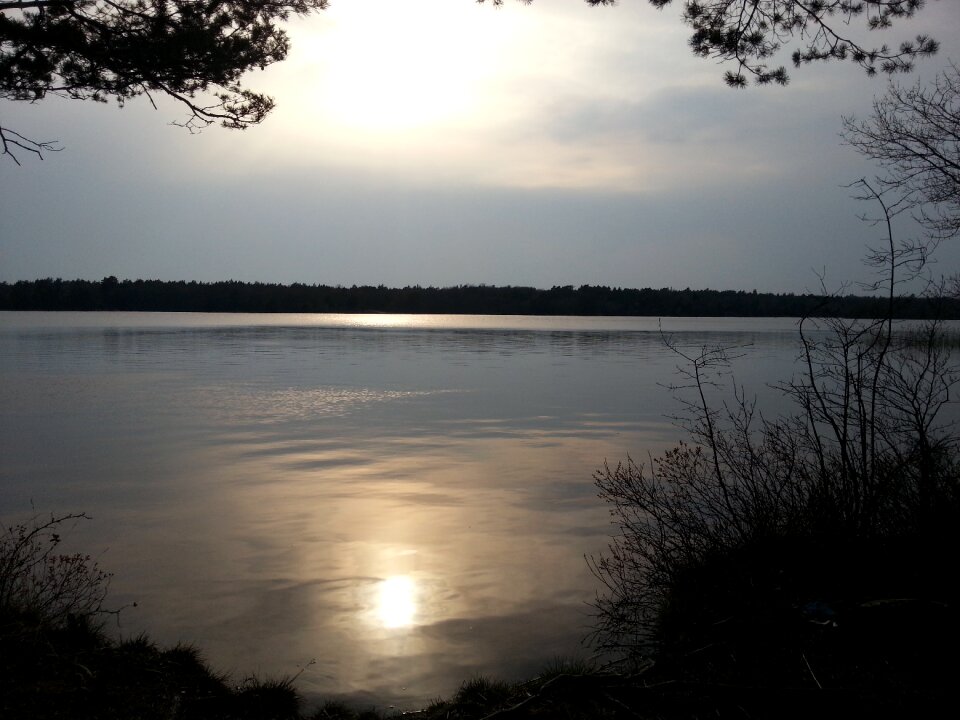 Sunset mirroring water