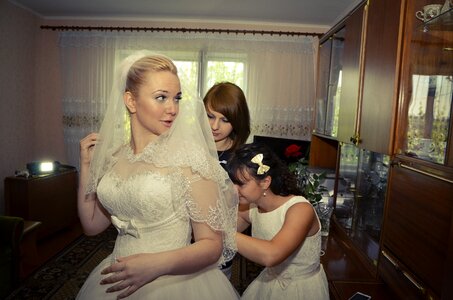 Bride wedding dress preparations photo