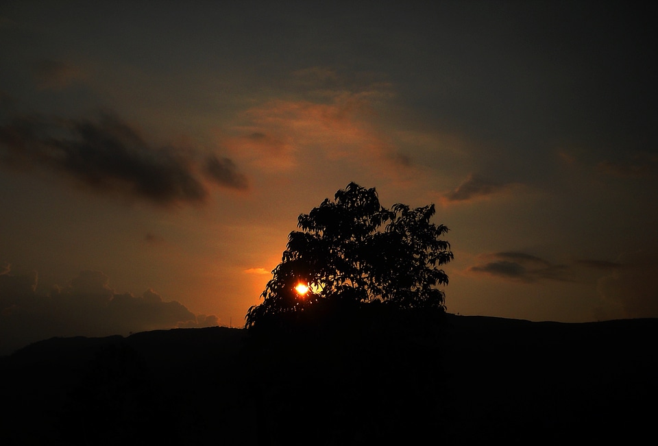 Hill sunset sky