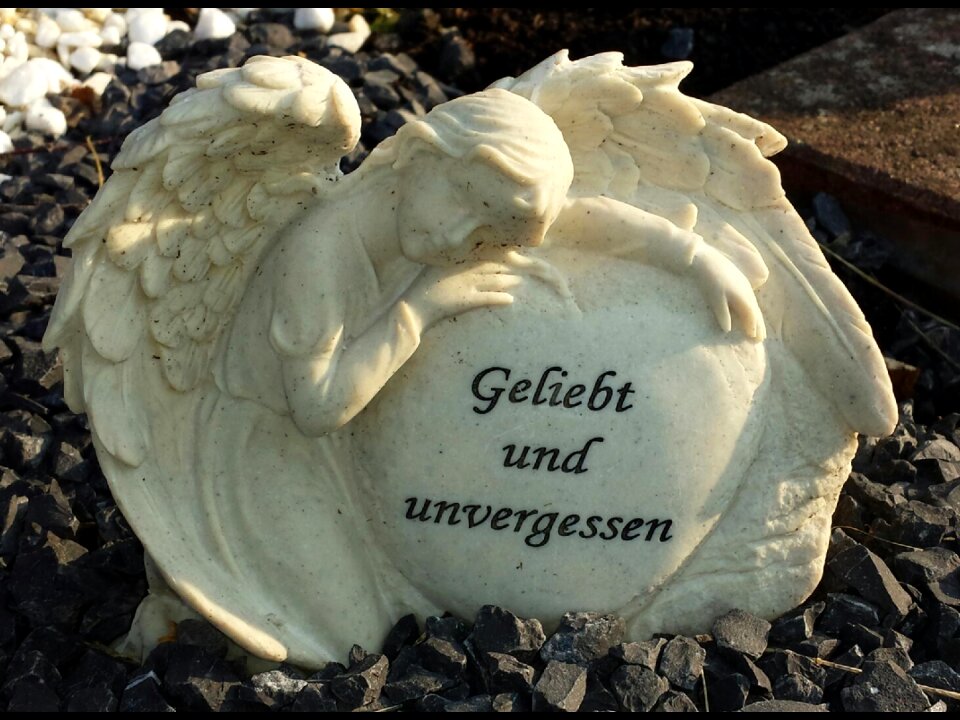 Statue mourning tombstone