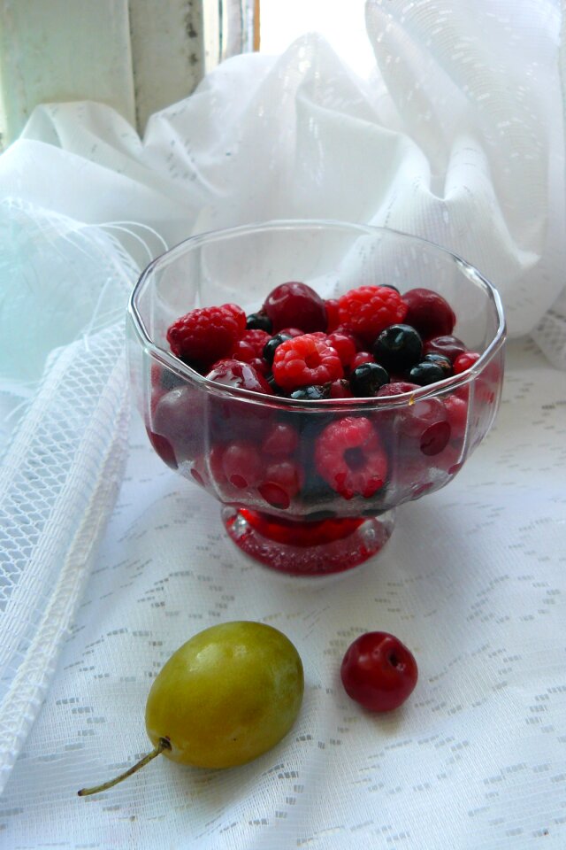 Plum vase made with berries still life