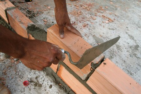 Hand brick construction photo