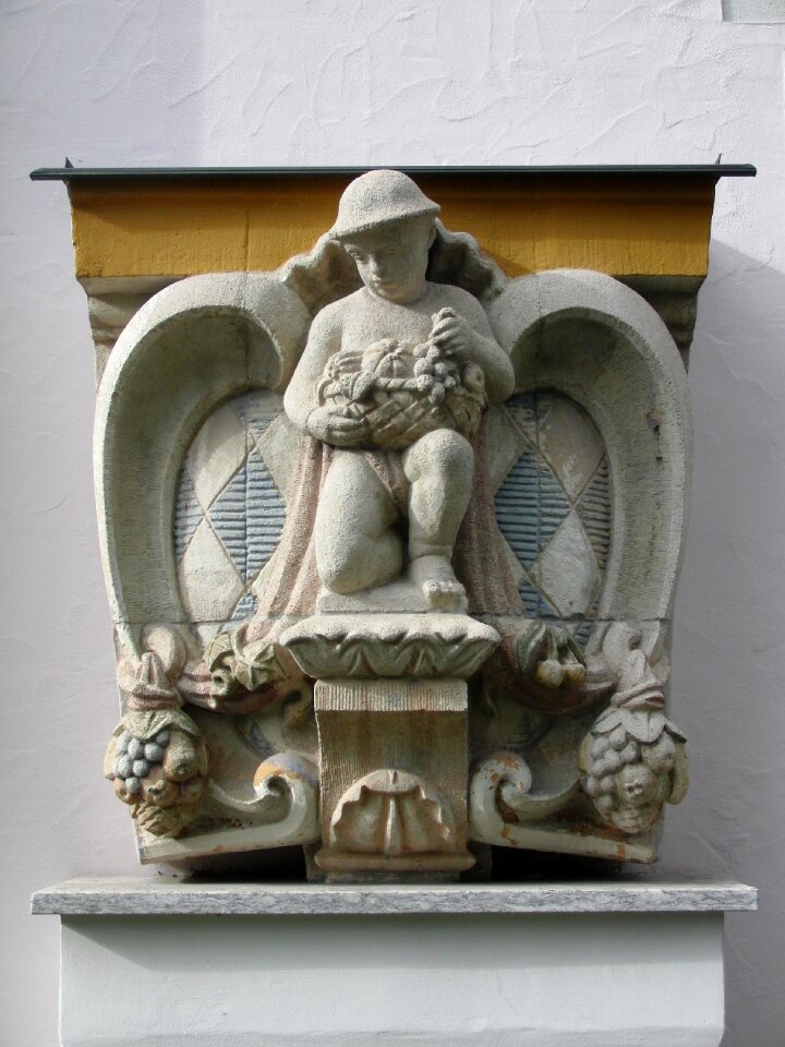 Stone coat of arms wall