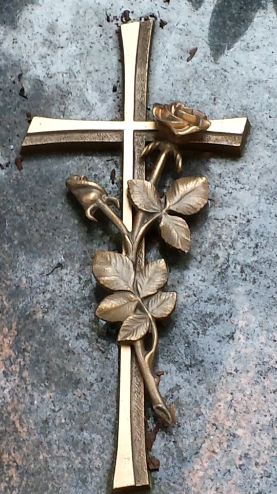 Cemetery tombstone sign of the cross