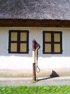 Village thatched roof window photo