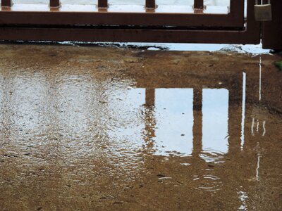 Gate sidewalk reflection