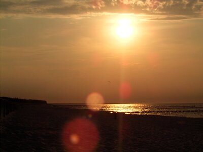 Sea sand sunset photo