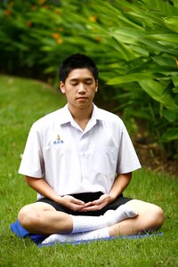 Buddhist boy meditate photo