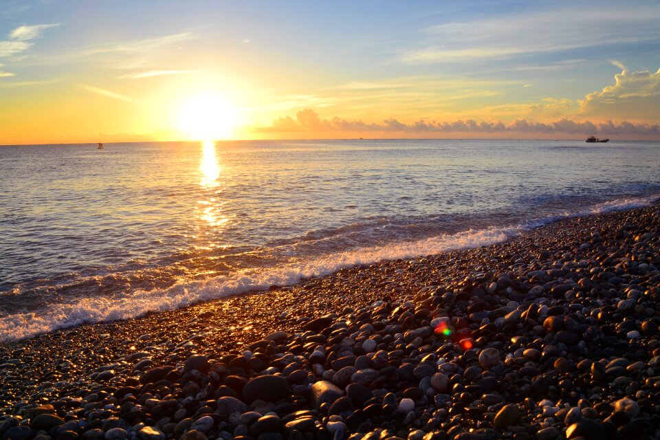 Sunrise cobblestone beach photo