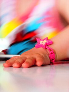 Child's hand a children's toy bracelet