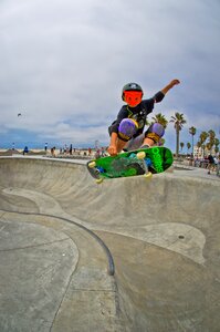 Boy half-pipe jump photo