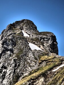 Steep exposed mountain peak photo