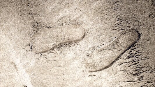 Footprints sand beach photo