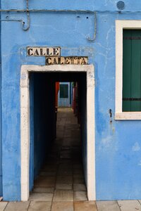 Burano island blue house narrow street photo