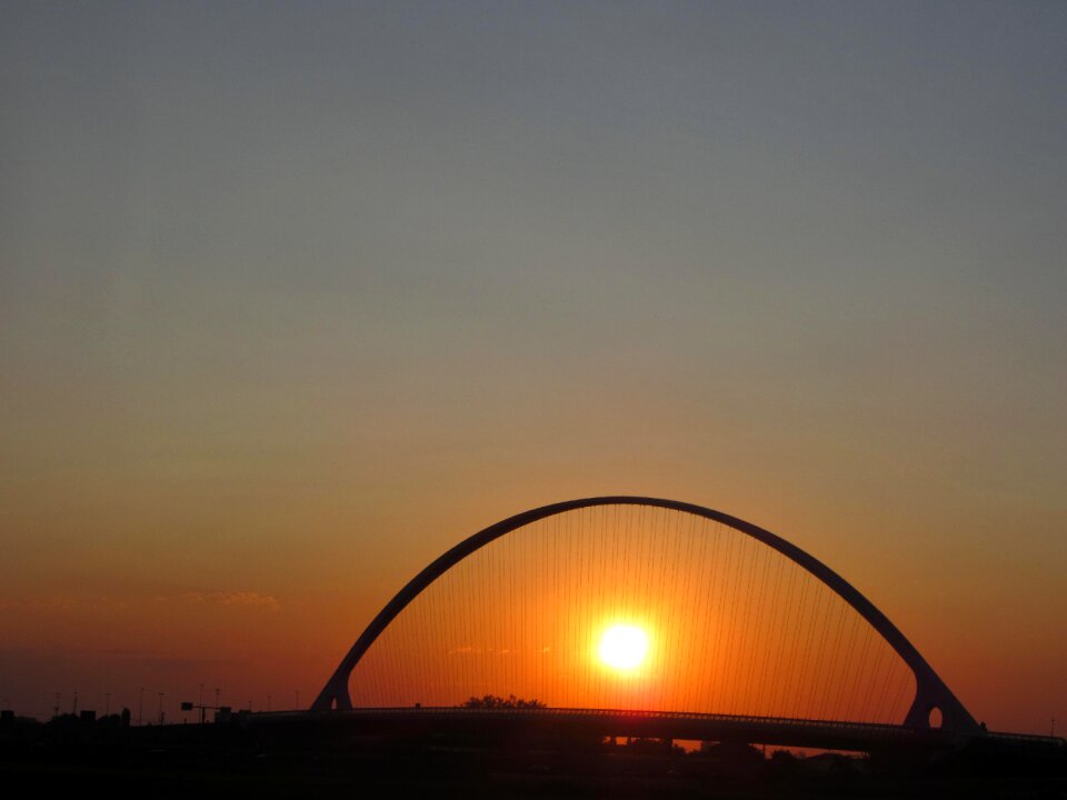 Silhouette bridge sun