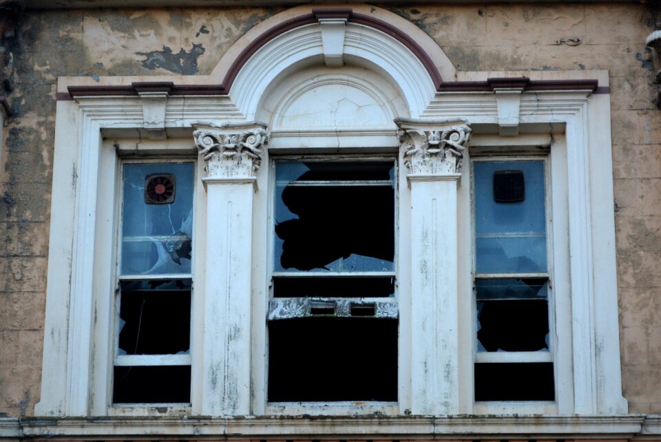Dilapidated building vandalism smashed windscreen