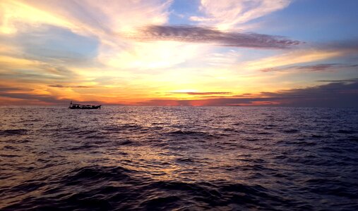 Sunset on the sea sun rays of the sun photo