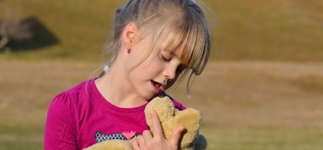 Child girl teddy bear photo
