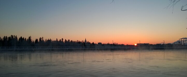 Oulu river sun glow