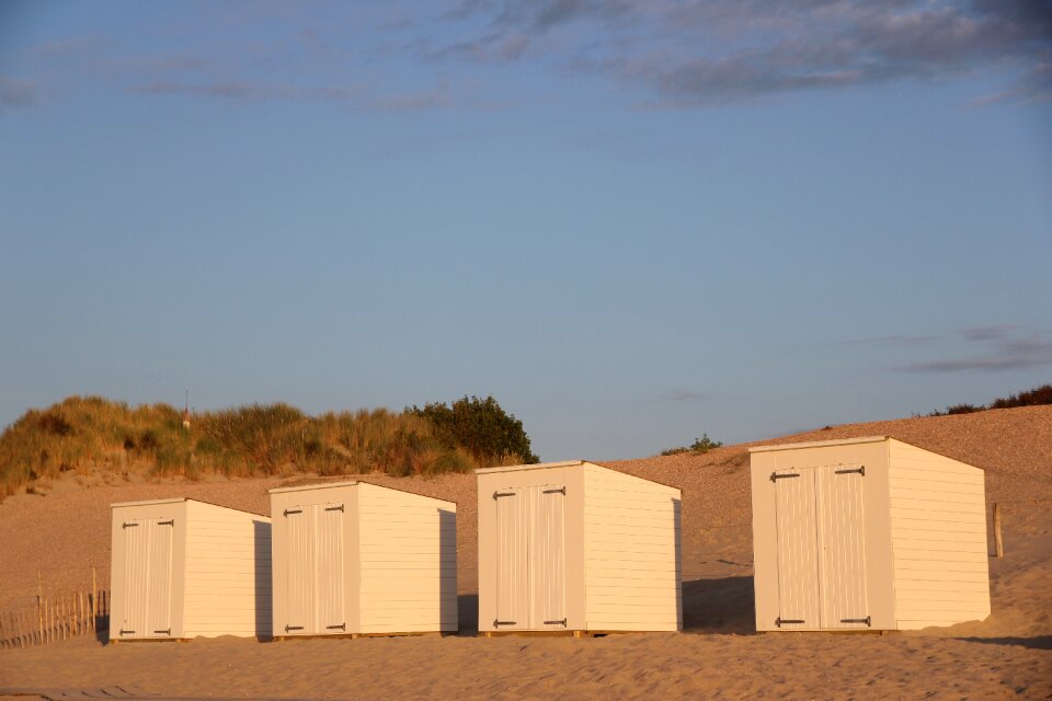 Beach hut blue sand photo