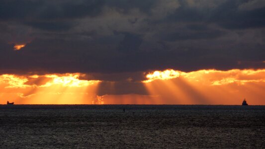 Sunbeam fireball setting sun photo