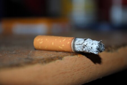 Cigarette smoker ash photo