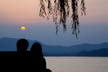 Sunset couple horizon photo