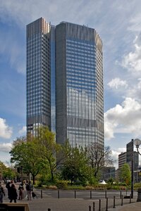 White clouds modern high rise building financial district photo