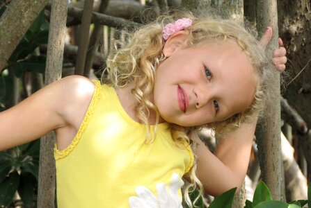The little girl a smile yellow blouse