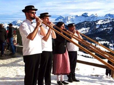 Alphorn blowers snow mountains folklore