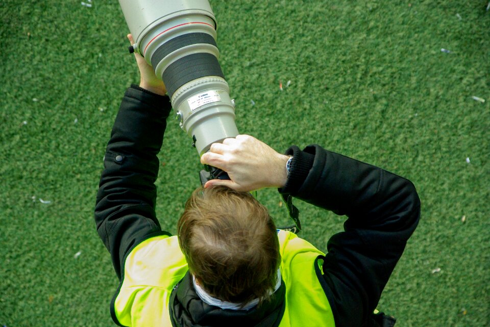 Telephoto lens camera reporter