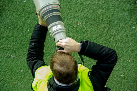 Telephoto lens camera reporter