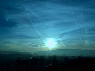 Winter sun backlighting flight tracks photo