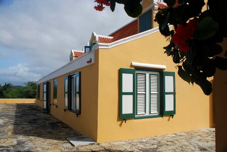 Plantation clouds yellow house