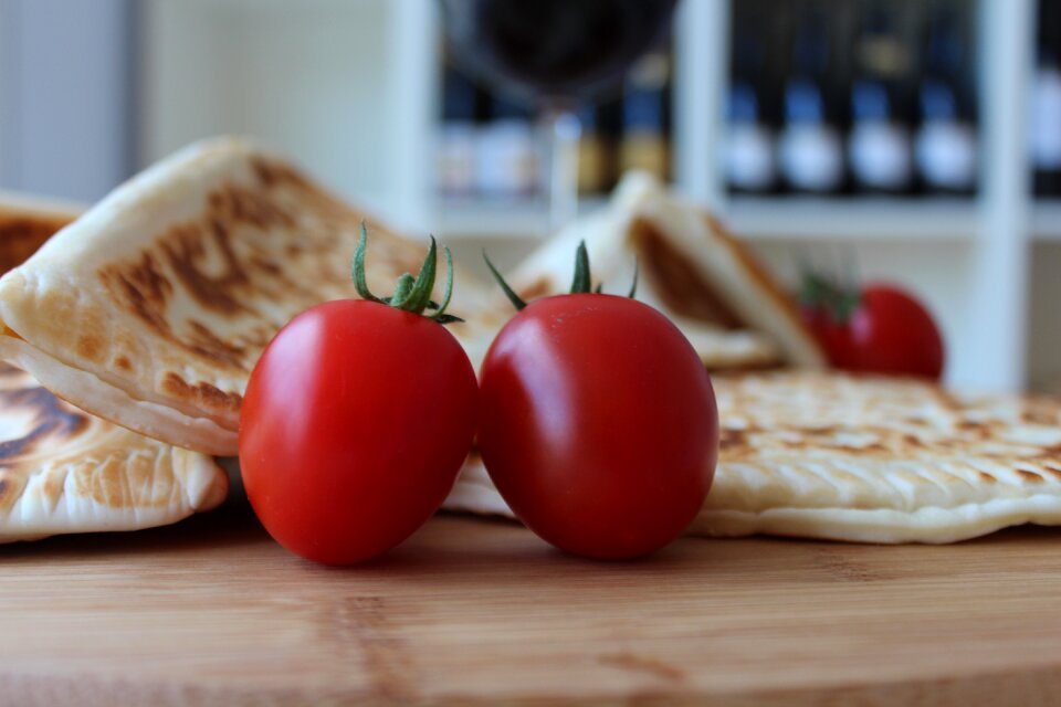 Tomatoes watercress chopping board