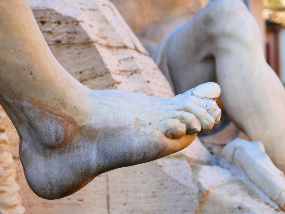 Stone sculpture barefoot