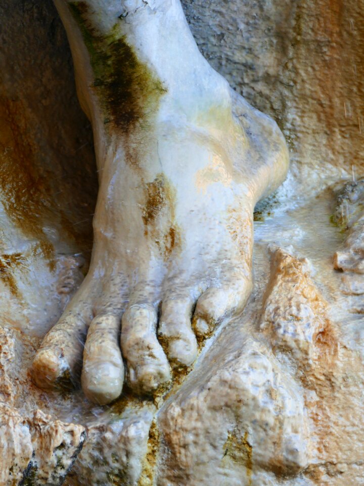 Stone sculpture barefoot