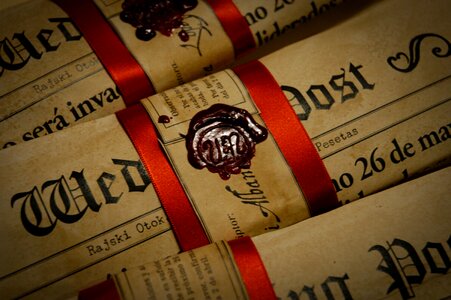 Old newspaper antique red ribbon