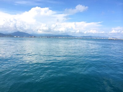 The sea blue sky and white clouds sea water photo