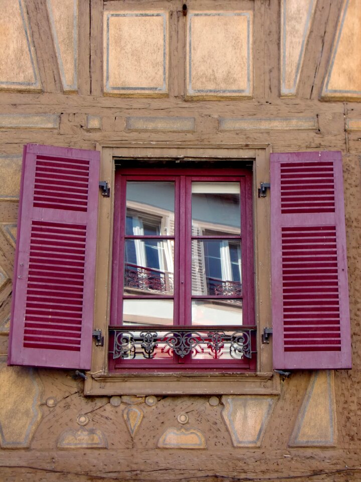 Open wooden shutters red photo