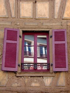 Open wooden shutters red photo
