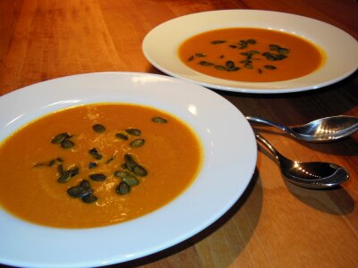 Spoon warm pumpkin soup photo