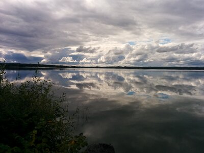 Horizon cloud mirroring photo