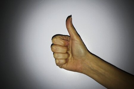 One thumb thumbs up