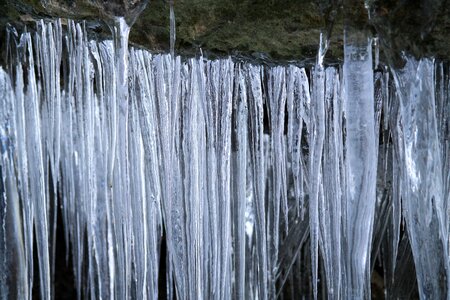 Snow frozen stalactites photo