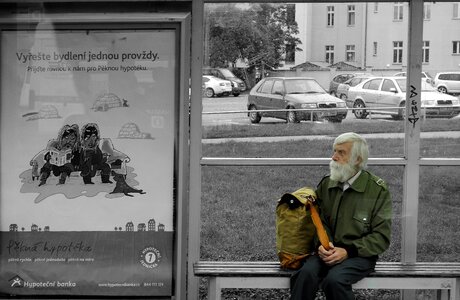 Old man bus stop black and white